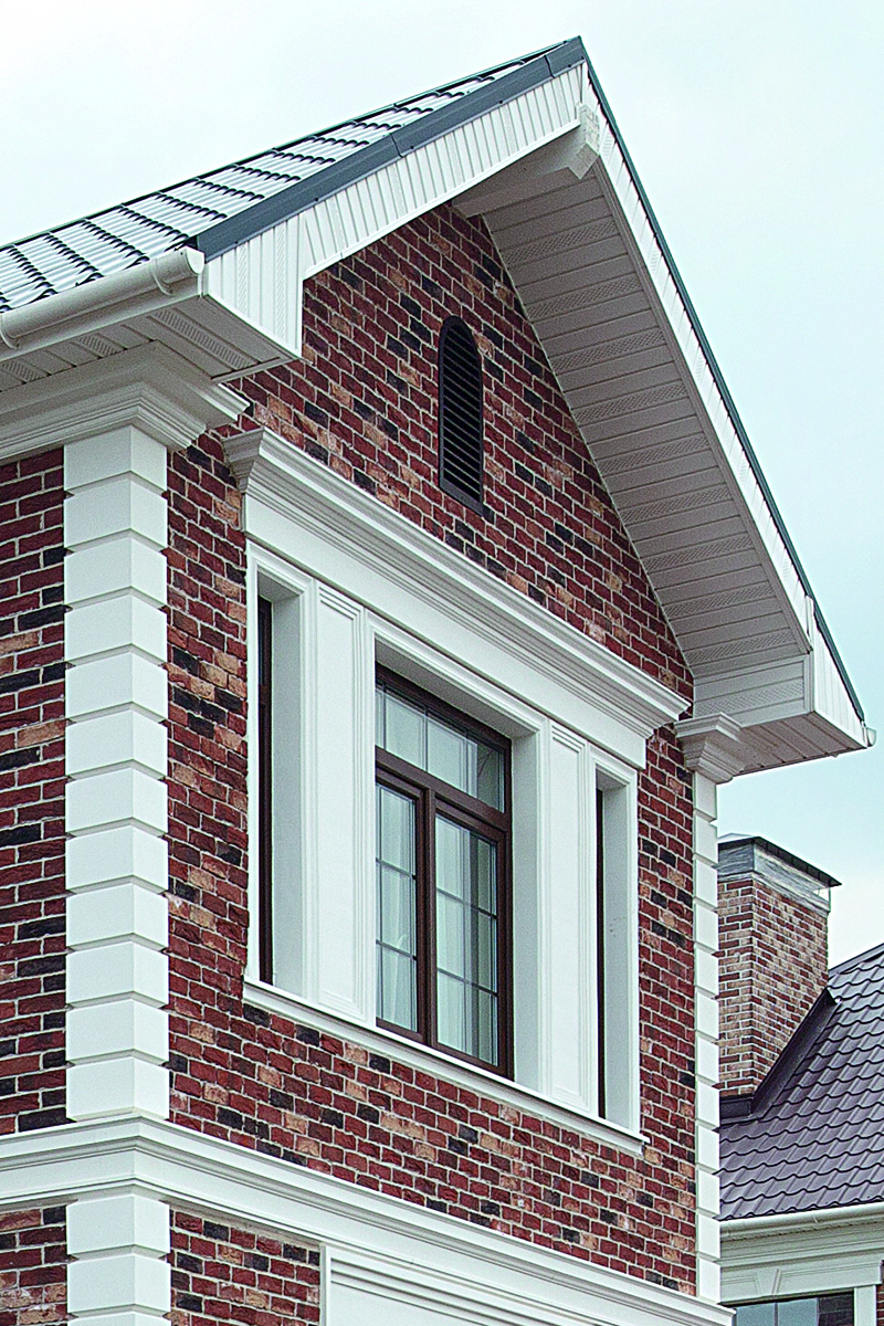 Brick house facade with Gaudi profiles, view 1