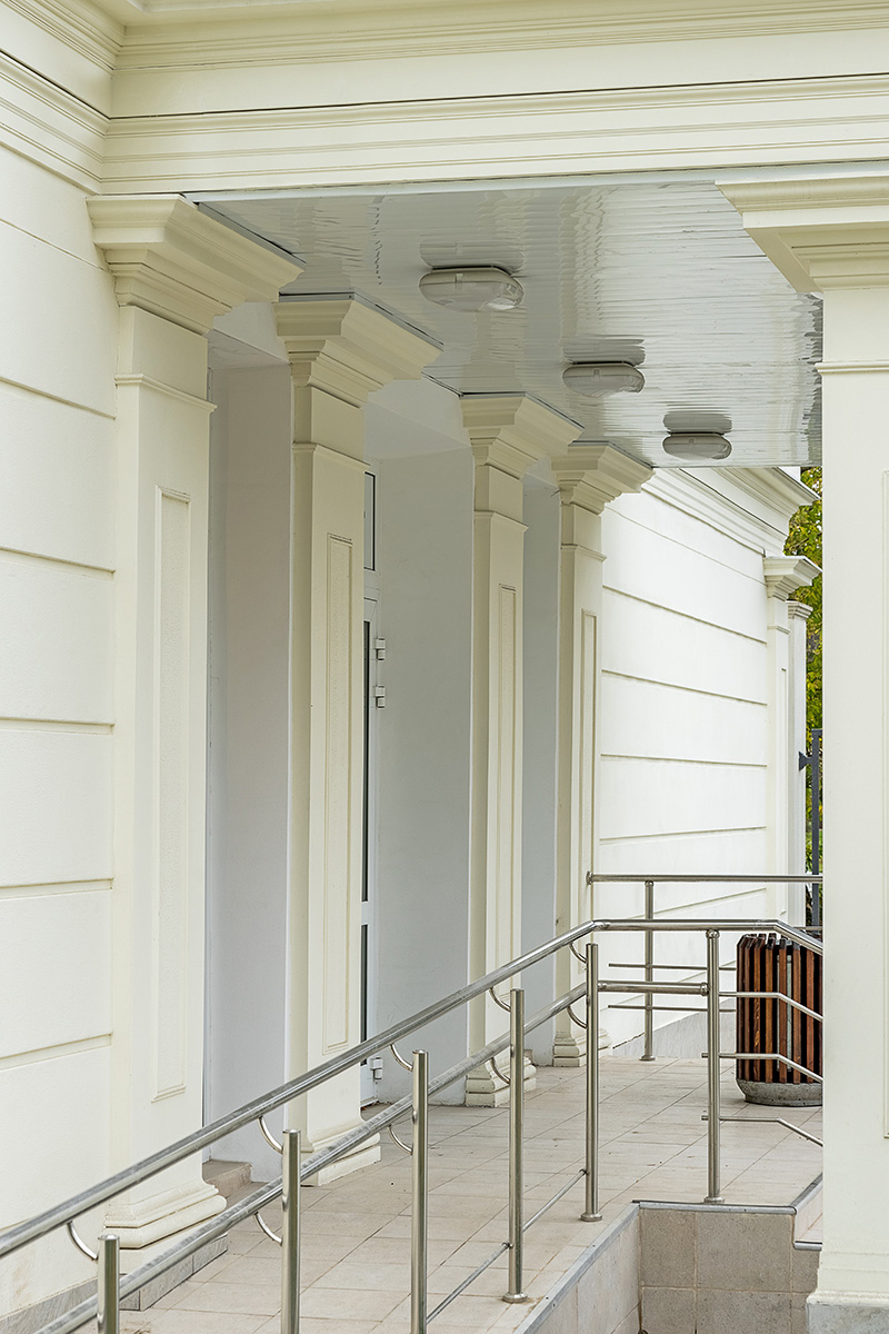Classic building facade with column, entablature and window frame
