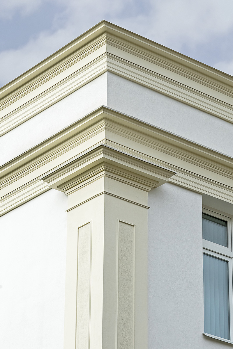 Classic building facade with cornice, frieze and mouldings